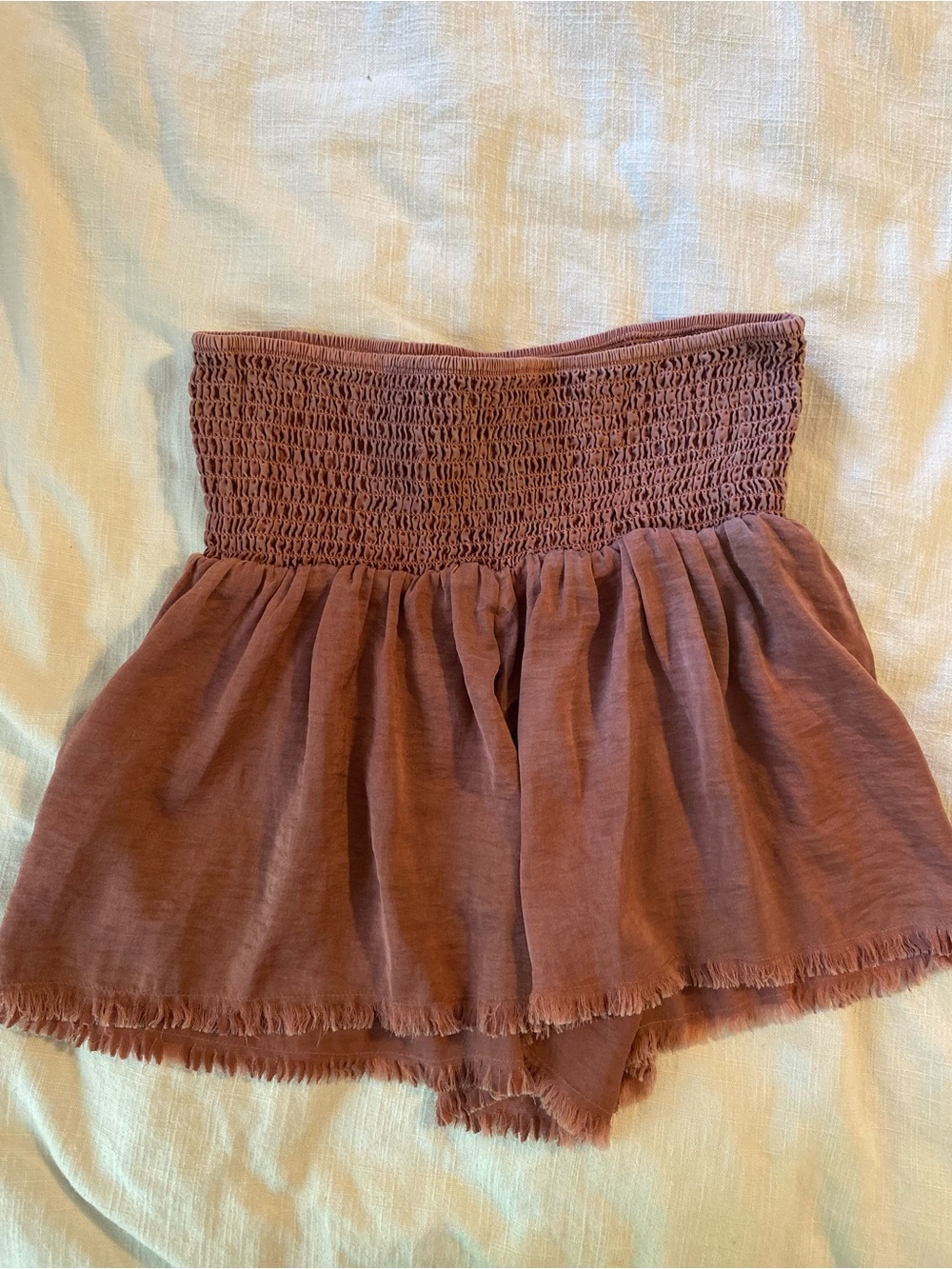 Aerie High Waist Smocked Ruffle Shorts in a Dusty Rose with fringe hem